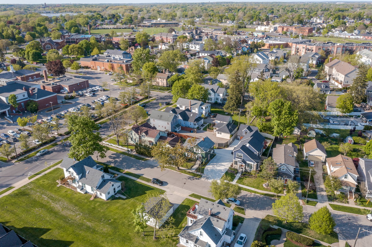 Ariel view of a neighborhood in Southeast Michigan with several small to medium sized homes ideal for buying a starter home